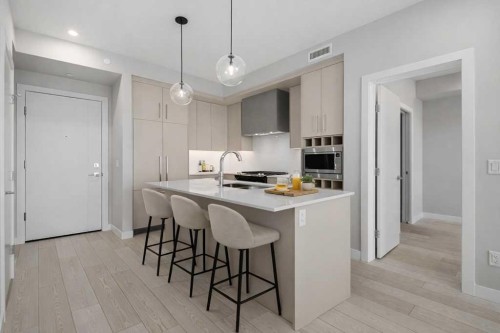 612-8230 Broadcast Avenue, Calgary, AB - Indoor Photo Showing Kitchen With Upgraded Kitchen