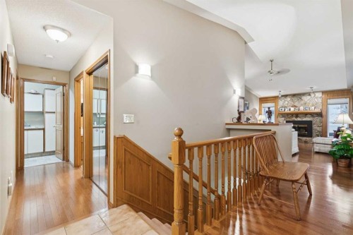 1025 Shawnee Road Sw, Calgary, AB - Indoor Photo Showing Other Room With Fireplace