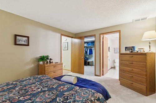 1025 Shawnee Road Sw, Calgary, AB - Indoor Photo Showing Bedroom