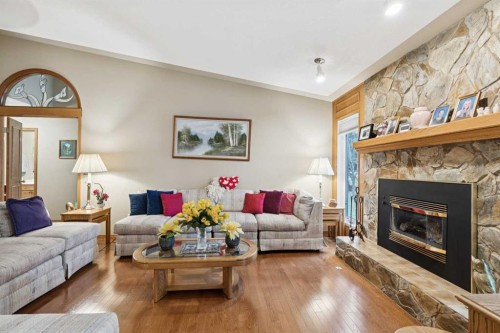 1025 Shawnee Road Sw, Calgary, AB - Indoor Photo Showing Living Room With Fireplace
