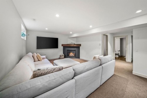 39 Wentworth Manor Sw, Calgary, AB - Indoor Photo Showing Living Room With Fireplace