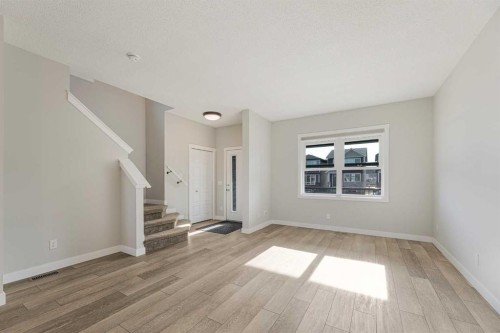 747 Creekside Boulevard Sw, Calgary, AB - Indoor Photo Showing Other Room