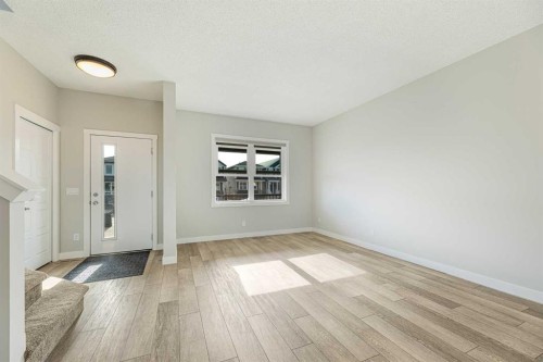 747 Creekside Boulevard Sw, Calgary, AB - Indoor Photo Showing Other Room