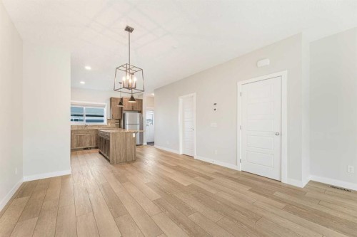 747 Creekside Boulevard Sw, Calgary, AB - Indoor Photo Showing Other Room