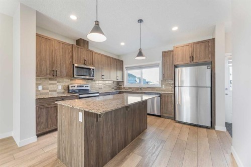 747 Creekside Boulevard Sw, Calgary, AB - Indoor Photo Showing Kitchen With Stainless Steel Kitchen With Upgraded Kitchen