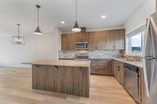 747 Creekside Boulevard Sw, Calgary, AB - Indoor Photo Showing Kitchen With Stainless Steel Kitchen With Upgraded Kitchen