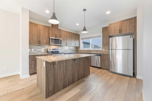 747 Creekside Boulevard Sw, Calgary, AB - Indoor Photo Showing Kitchen With Stainless Steel Kitchen With Upgraded Kitchen