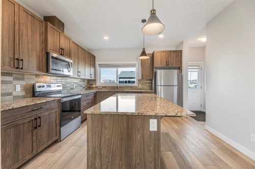 747 Creekside Boulevard Sw, Calgary, AB - Indoor Photo Showing Kitchen With Upgraded Kitchen