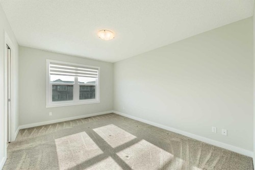 747 Creekside Boulevard Sw, Calgary, AB - Indoor Photo Showing Other Room