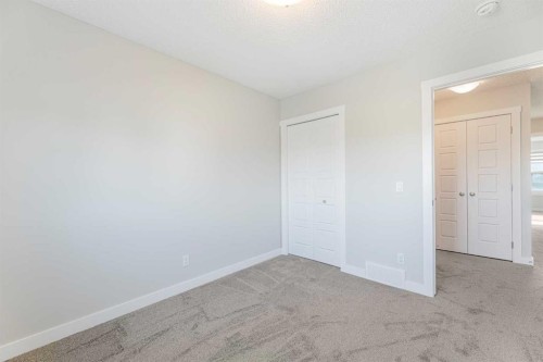 747 Creekside Boulevard Sw, Calgary, AB - Indoor Photo Showing Other Room