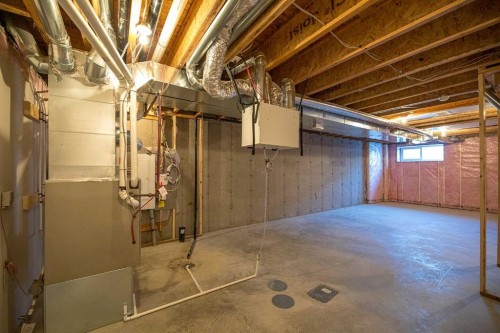 747 Creekside Boulevard Sw, Calgary, AB - Indoor Photo Showing Basement