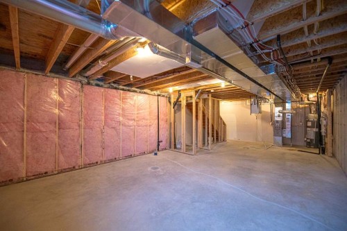 747 Creekside Boulevard Sw, Calgary, AB - Indoor Photo Showing Basement