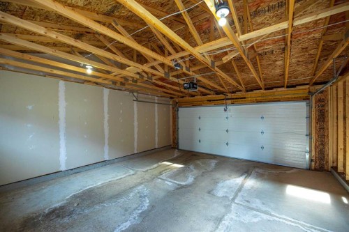 747 Creekside Boulevard Sw, Calgary, AB - Indoor Photo Showing Garage