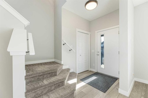 747 Creekside Boulevard Sw, Calgary, AB - Indoor Photo Showing Other Room