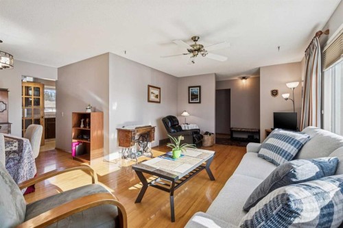 256 Huntridge Road Ne, Calgary, AB - Indoor Photo Showing Living Room