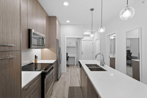 2408-76 Cornerstone Passage Ne, Calgary, AB - Indoor Photo Showing Kitchen With Double Sink With Upgraded Kitchen