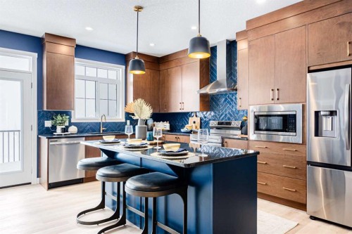 691 Buffaloberry Manor Se, Calgary, AB - Indoor Photo Showing Kitchen With Stainless Steel Kitchen