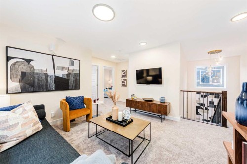 691 Buffaloberry Manor Se, Calgary, AB - Indoor Photo Showing Living Room