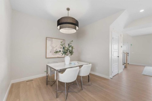 84 Buffaloberry Manor Se, Calgary, AB - Indoor Photo Showing Dining Room