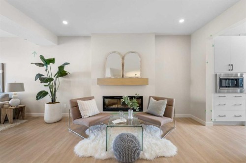 84 Buffaloberry Manor Se, Calgary, AB - Indoor Photo Showing Living Room With Fireplace