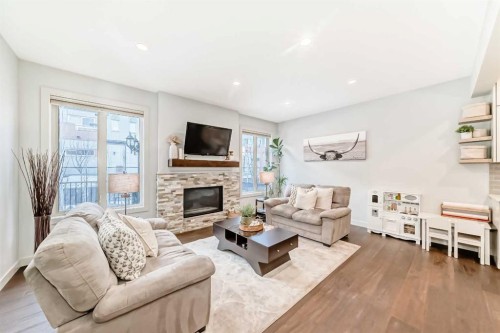 743 Shawnee Drive Sw, Calgary, AB - Indoor Photo Showing Living Room With Fireplace