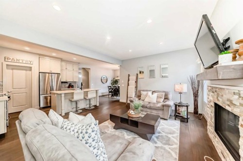 743 Shawnee Drive Sw, Calgary, AB - Indoor Photo Showing Living Room With Fireplace
