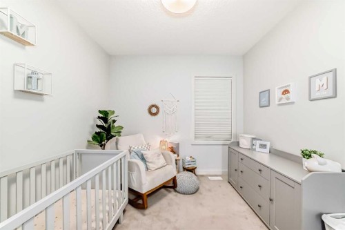743 Shawnee Drive Sw, Calgary, AB - Indoor Photo Showing Bedroom