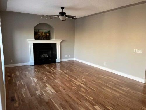 75 Royal Abbey Rise Nw, Calgary, AB - Indoor Photo Showing Other Room With Fireplace