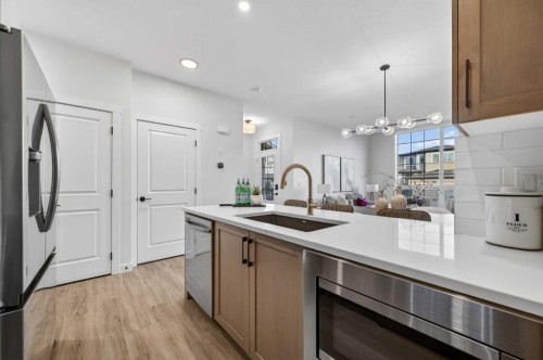 1051 Bayview Crescent, Airdrie, AB - Indoor Photo Showing Kitchen With Upgraded Kitchen