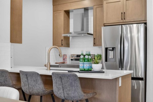 1051 Bayview Crescent, Airdrie, AB - Indoor Photo Showing Kitchen With Upgraded Kitchen