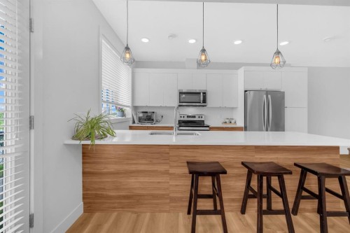 4397 Seton Drive Se, Calgary, AB - Indoor Photo Showing Kitchen With Upgraded Kitchen