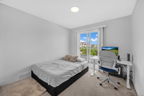 4397 Seton Drive Se, Calgary, AB - Indoor Photo Showing Bedroom