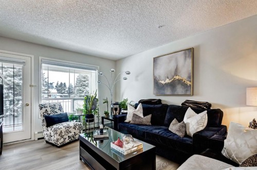 203-2144 Paliswood Road Sw, Calgary, AB - Indoor Photo Showing Living Room