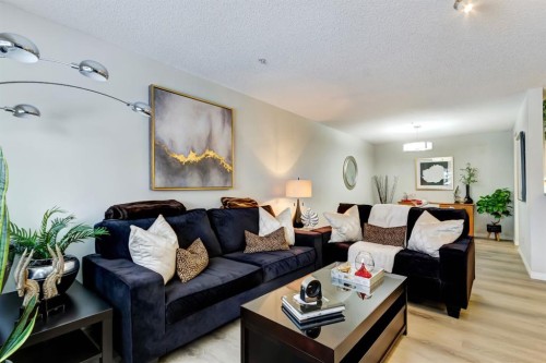 203-2144 Paliswood Road Sw, Calgary, AB - Indoor Photo Showing Living Room
