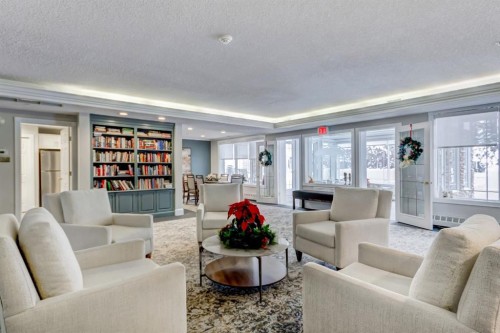 203-2144 Paliswood Road Sw, Calgary, AB - Indoor Photo Showing Living Room
