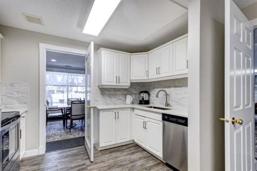 203-2144 Paliswood Road Sw, Calgary, AB - Indoor Photo Showing Kitchen With Stainless Steel Kitchen