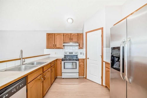 152 Saddlecreek Terrace Ne, Calgary, AB - Indoor Photo Showing Kitchen With Double Sink