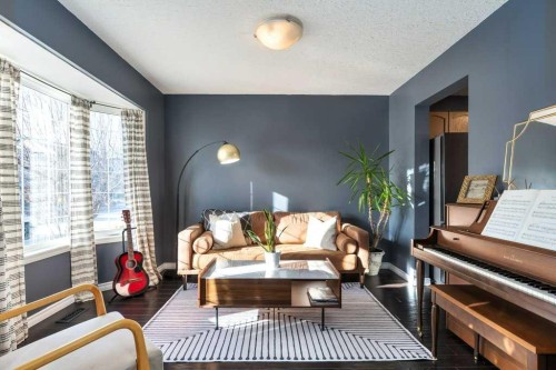 28 Everstone Way Sw, Calgary, AB - Indoor Photo Showing Living Room With Fireplace