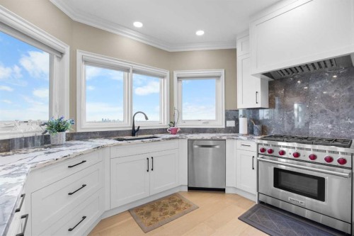 57 Edelweiss Point Nw, Calgary, AB - Indoor Photo Showing Kitchen With Stainless Steel Kitchen With Upgraded Kitchen