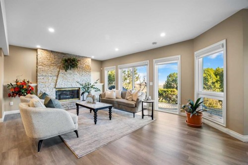 57 Edelweiss Point Nw, Calgary, AB - Indoor Photo Showing Living Room With Fireplace