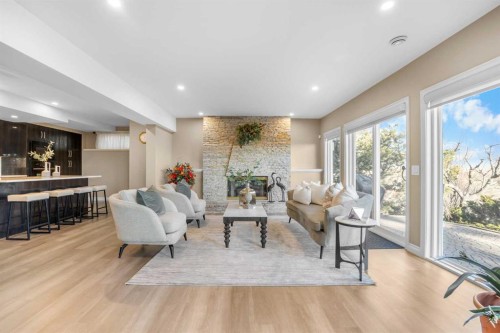 57 Edelweiss Point Nw, Calgary, AB - Indoor Photo Showing Living Room With Fireplace