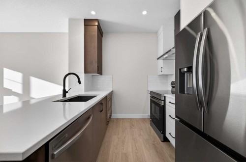 2230 Bayview Drive, Airdrie, AB - Indoor Photo Showing Kitchen With Stainless Steel Kitchen With Upgraded Kitchen