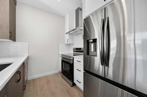 2230 Bayview Drive, Airdrie, AB - Indoor Photo Showing Kitchen With Stainless Steel Kitchen