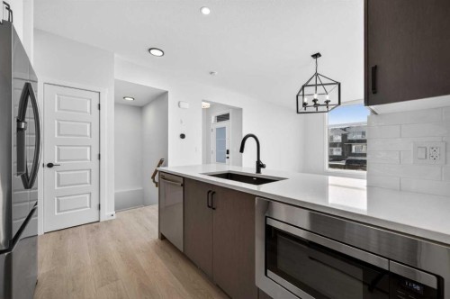 2230 Bayview Drive, Airdrie, AB - Indoor Photo Showing Kitchen With Stainless Steel Kitchen With Upgraded Kitchen