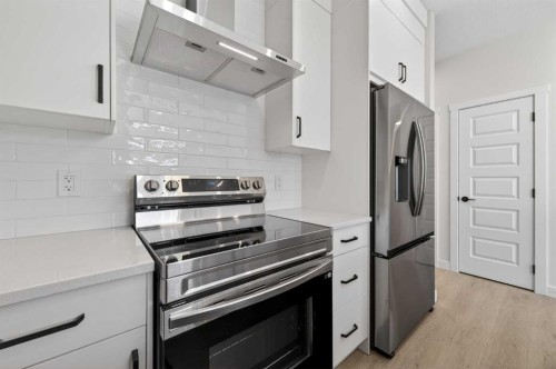 2230 Bayview Drive, Airdrie, AB - Indoor Photo Showing Kitchen With Stainless Steel Kitchen