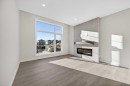 2230 Bayview Drive, Airdrie, AB  - Indoor Photo Showing Living Room With Fireplace 