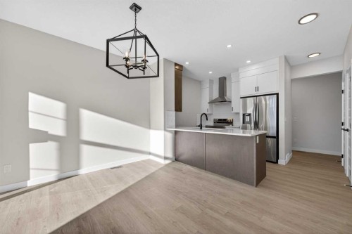 2230 Bayview Drive, Airdrie, AB - Indoor Photo Showing Kitchen With Stainless Steel Kitchen With Upgraded Kitchen