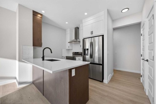 2230 Bayview Drive, Airdrie, AB - Indoor Photo Showing Kitchen With Stainless Steel Kitchen With Upgraded Kitchen