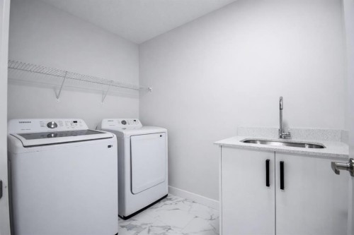 113 Corner Meadows Square Ne, Calgary, AB - Indoor Photo Showing Laundry Room