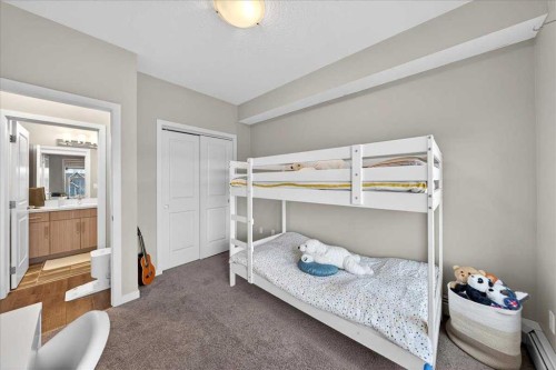302-200 Cranfield Common Se, Calgary, AB - Indoor Photo Showing Bedroom
